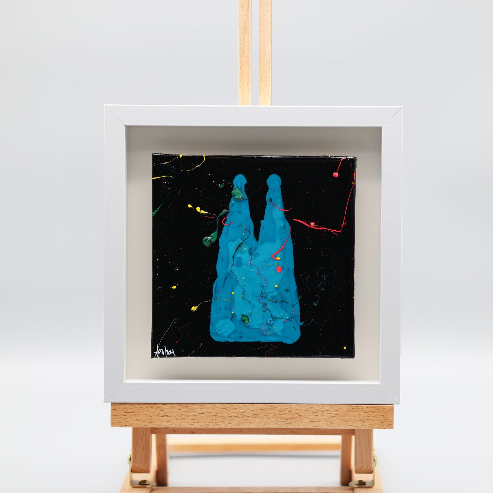 Acrylbild Kölner Dom in Blau mit bunten Farbakzenten von Pixel Cafe Cologne im weißen Rahmen